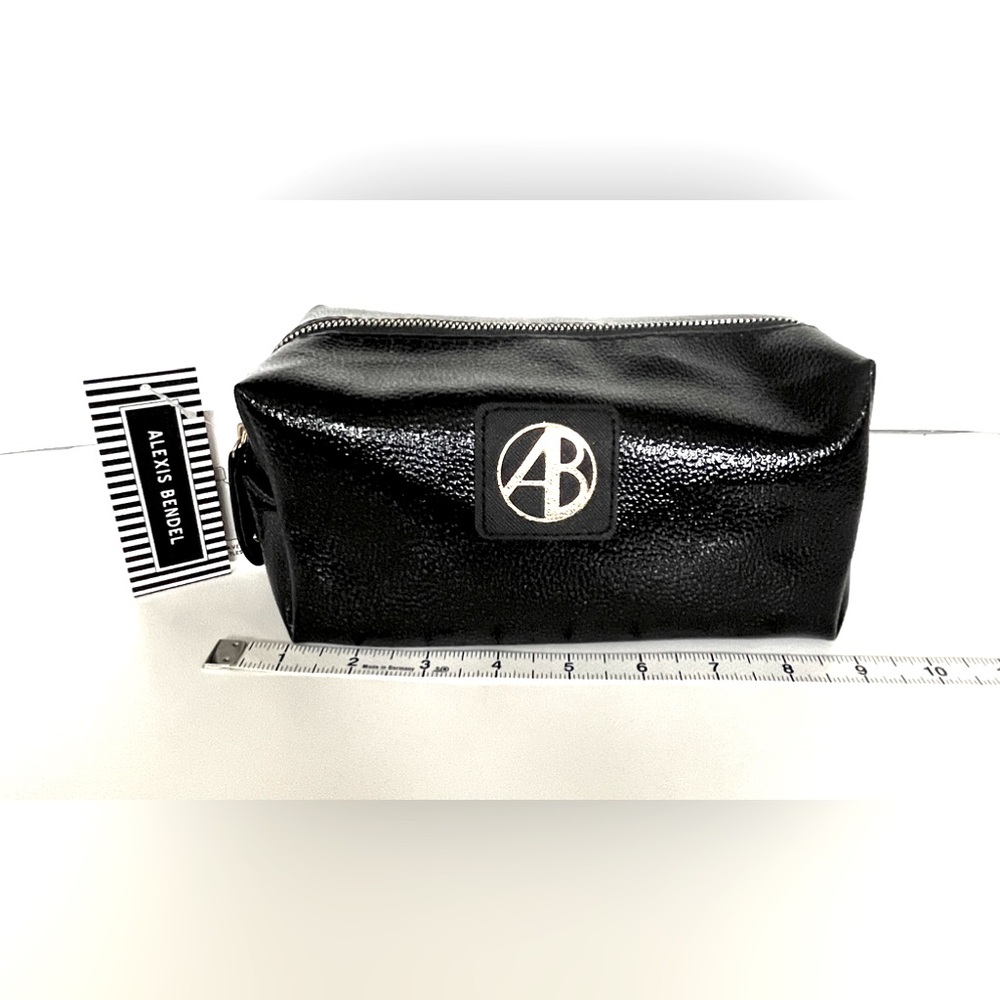 NWT XOXO Cosmetic bag/ toiletries bag with 2 travel size bottles inside. Black